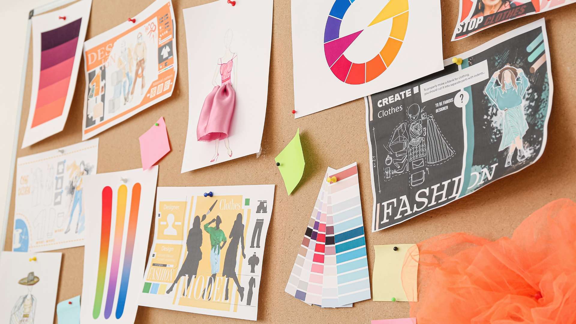 Cork board with fashion-related items representing a fashion marketing agency